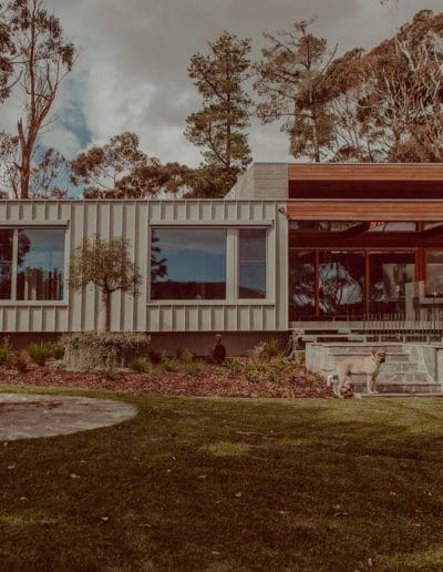 Photo of fire pit and landscaped garden in front of modern house