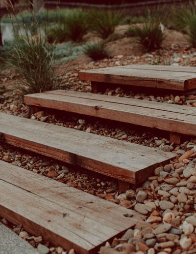 Closeup photo of timber steps in Australian native garden