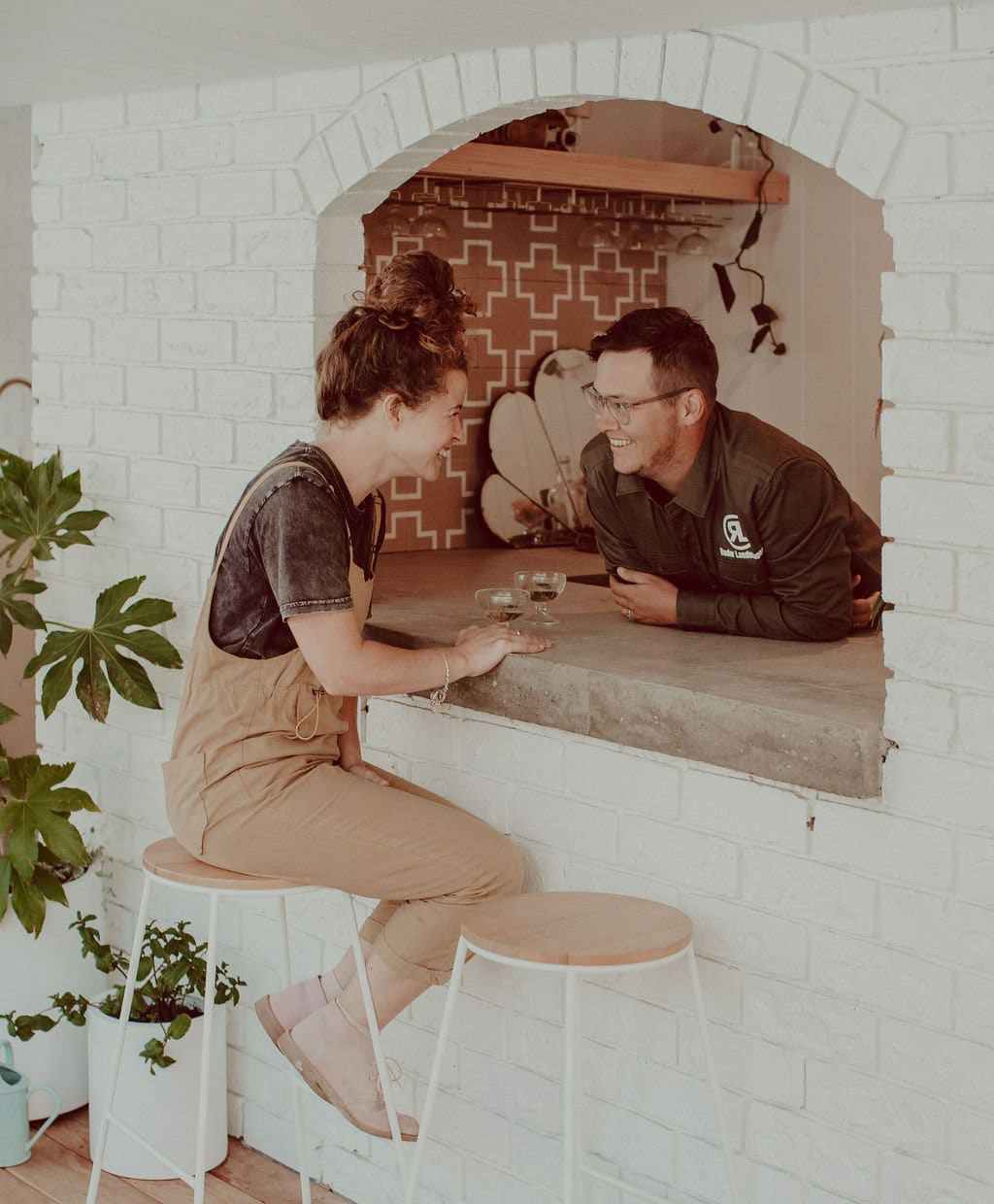 Photo of Radar Landscapes directors sitting at a backyard bar